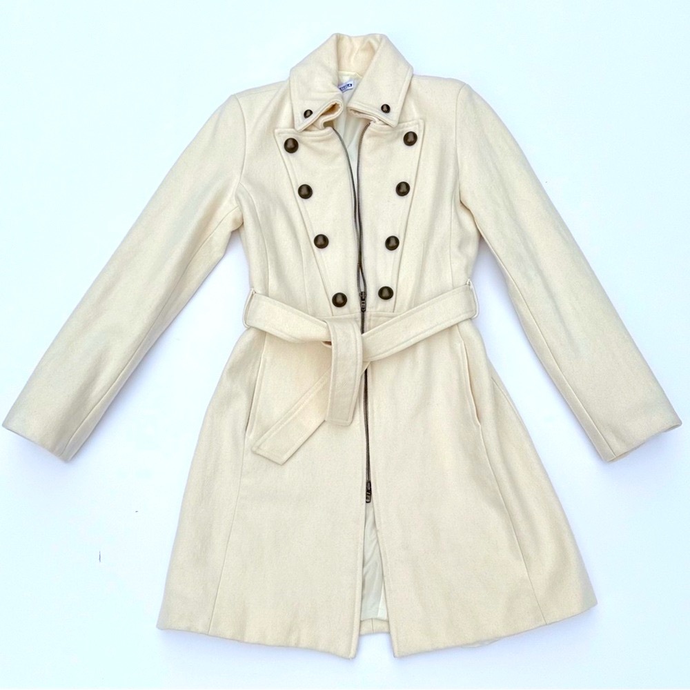 Elegant double-breasted wool blend coat in a soft ivory cream.